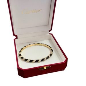 Cartier's classic black and gold bracelet