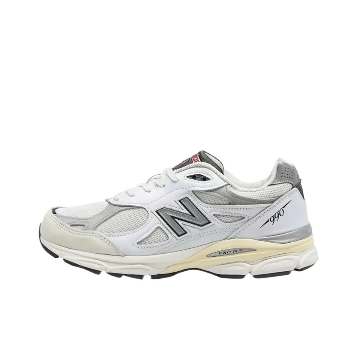 New Balance 990 series retro-style white and grey sports shoes.