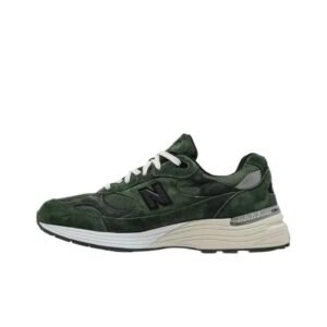 Retro-style olive green New Balance athletic shoes.